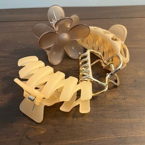 collection of hair clips flower clip, gold Kitch clip and 2 flowered clips